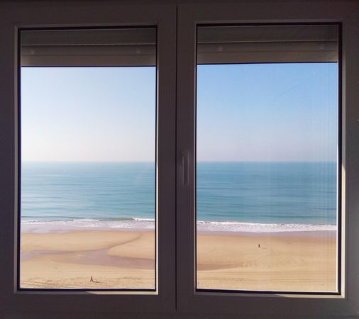 Close glass window viewing blue sea in Cádiz, Andalucía, Spain