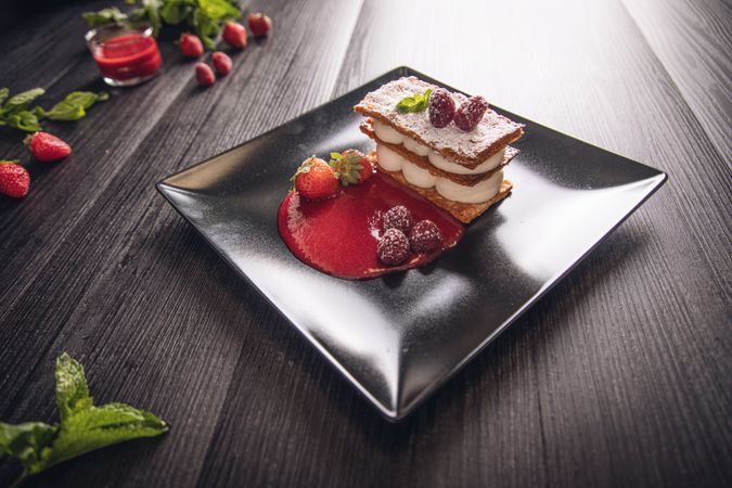 Diphlomate cream and red fruit strudel in elegant plate