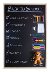 School supplies over chalkboard background