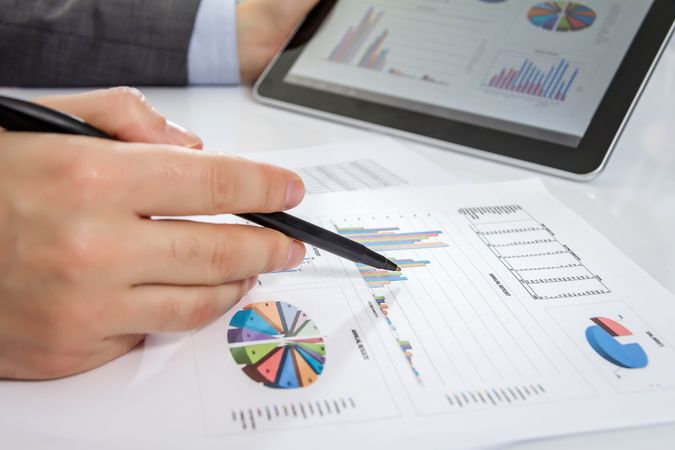 Businessman reviewing documents in digital tablet