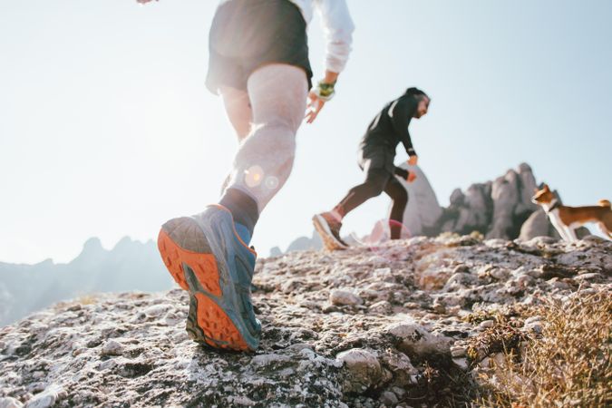 Two men running uphill