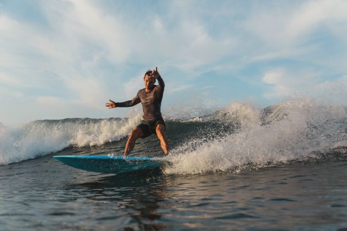 Man on surf board on waving water