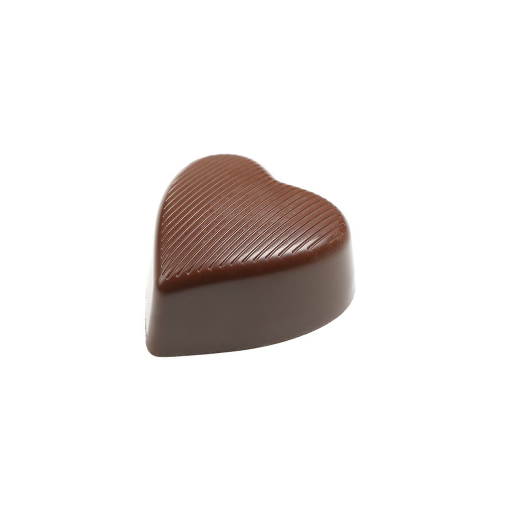Tasty chocolate candy in the heart form isolated on studio background