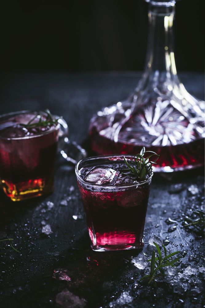 Glasses and carafe with red wine on table