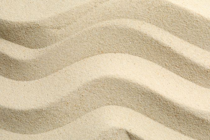 Seamless sand on a whole background, space for text. Summer vacation backdrop