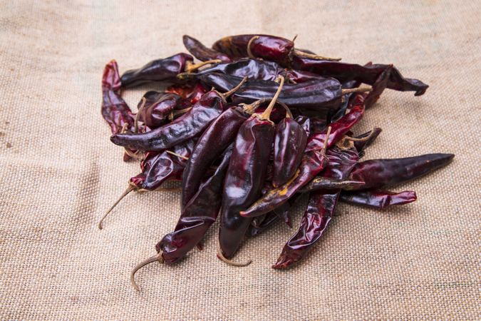 Some Dry Pepper or red chili on the brown jute fiber fabric