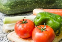 Fresh vegetables on cutting board in the kitchen