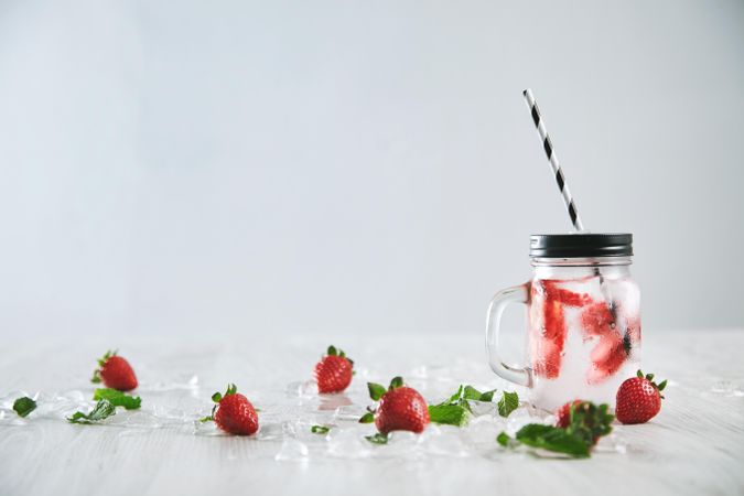 Single glass of strawberry infused water