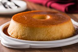 Ring of panna cotta or flan served on table