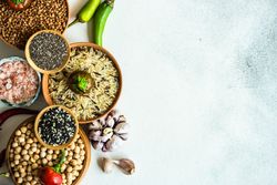 Top view of bowls of legumes and rice