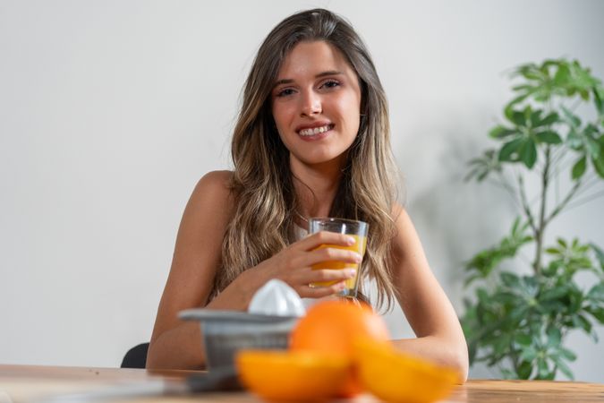 Woman drinking orange juice morning breakfast healthy lifestyle vitamin fresh fruit nutrition wellness smile