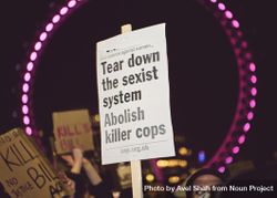 London, England, United Kingdom - March 16, 2021: Protest sign framed by London Eye 5zd1jb