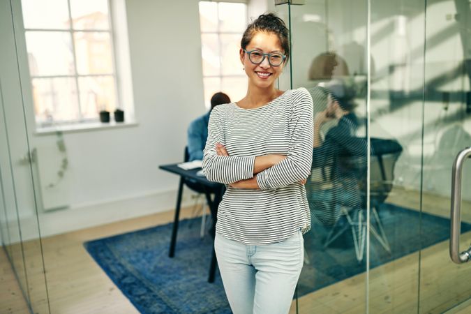 Portrait of trendy woman smiling in the office