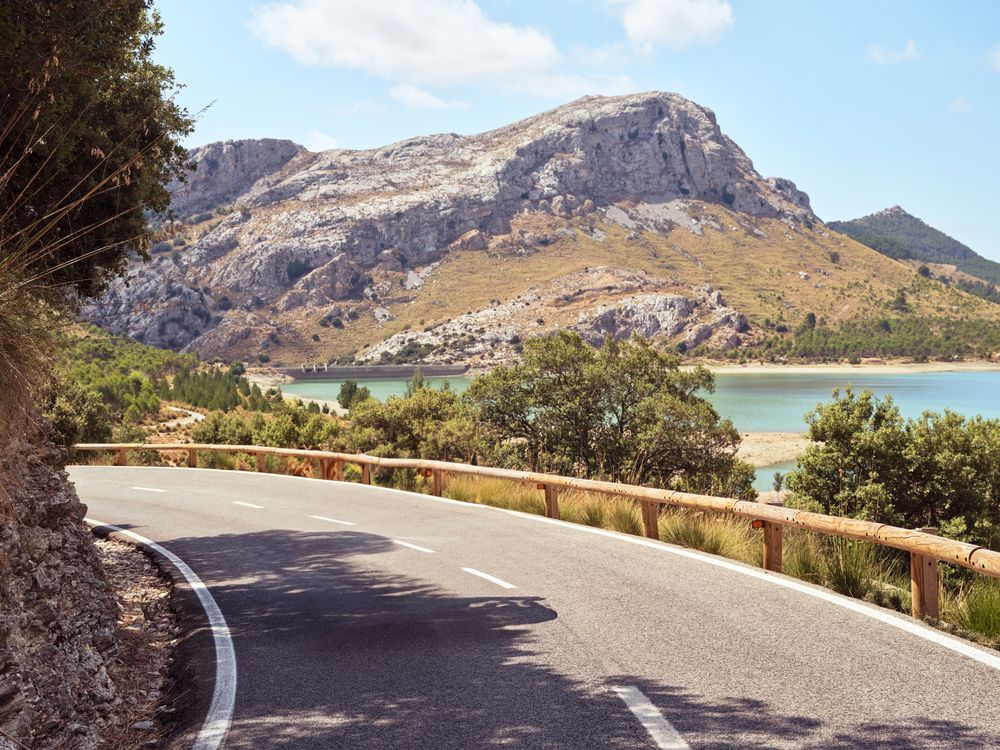Scenic mountainous countryside near lake and bridge in Spain