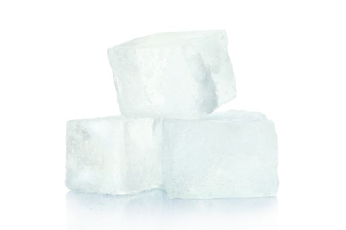 Ice cubes on plain background