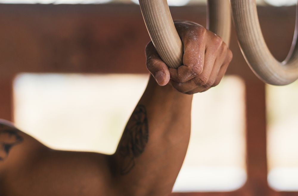 man hand holding a gymnastic ring, close-up