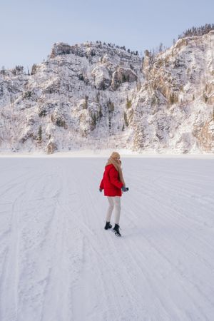 Frozen woman wrapped in scarf on winter day