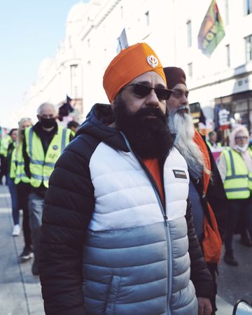 London, England, United Kingdom - March 19 2022: Man in Sikh turban and puffa jacket