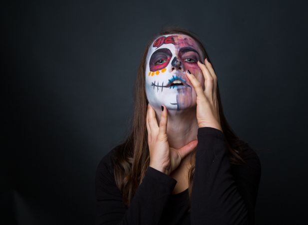 Young woman with creepy face paint