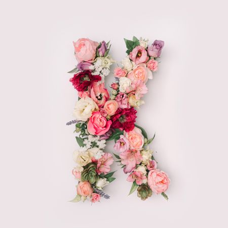 Letter K made of real natural flowers and leaves
