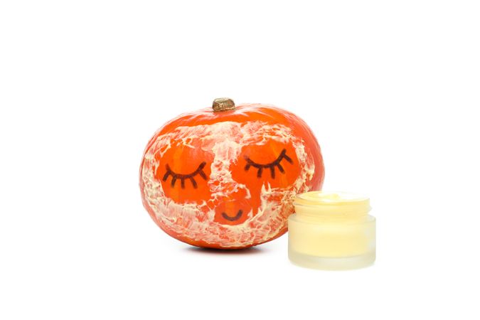Concept of different cosmetic products, Pumpkin cosmetics, isolated on light background
