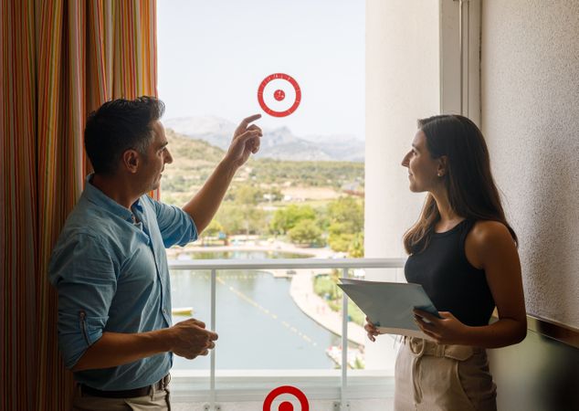 Safety inspectors checking stickers on hotel window