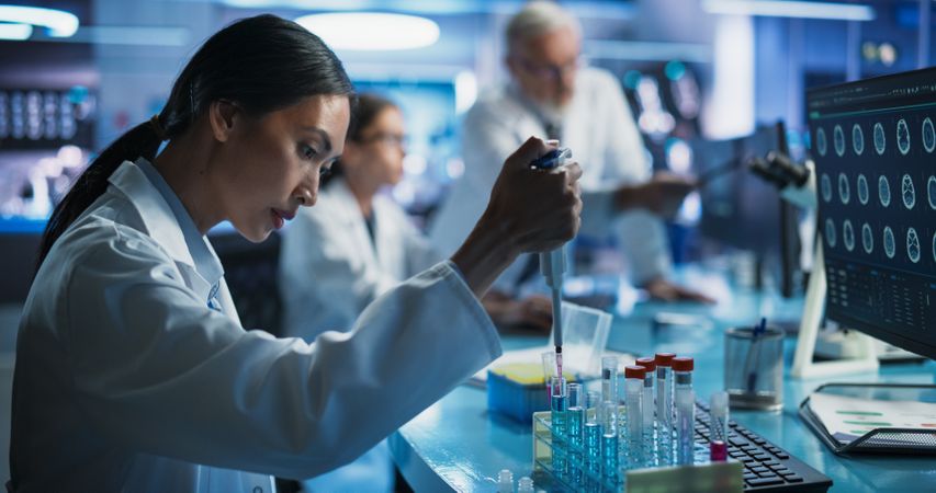 Pharmaceutical Research Laboratory: Female Asian Doctor Working With Test Tubes To Study Innovative Mental Disorder Medicine.