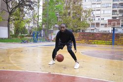 Active Lifestyle of Young Man Playing Basketball.