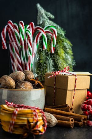 Christmassy table with dried fruit, strings, cinnamon and holly