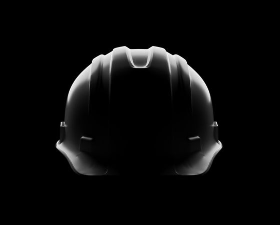 Dramatically Lit Hard Hat Isolated on a Dark Background.