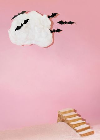Single cloud with bats and wooden staircase