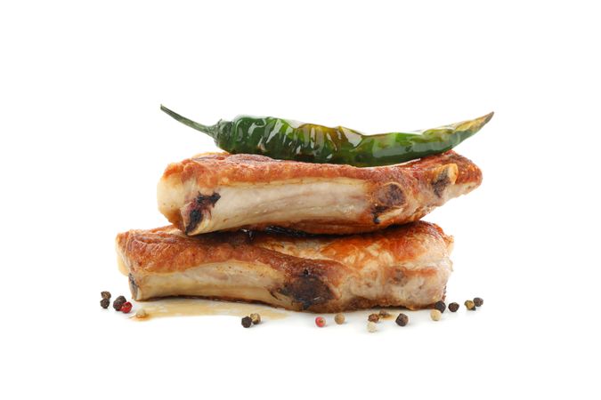 Fried steaks isolated on blank background. Grilled food