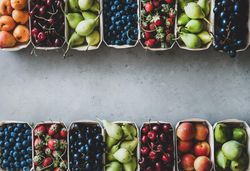 Rows fresh fruit arranged together in eco-friendly boxed, copy space