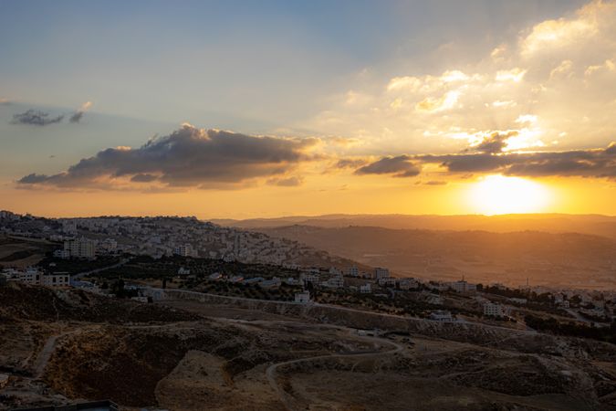 High-angle view of Amman's cityscape at sunset