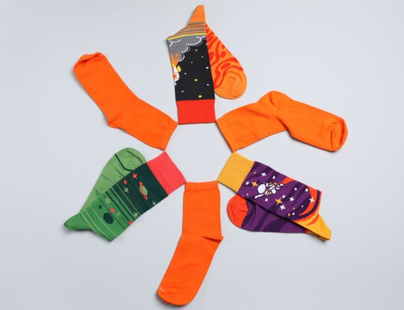 Casual clothes and wearing concept - socks, clothes for foot