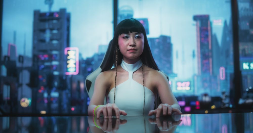 Stylish Japanese Young Woman Interacting with Augmented Reality Platform in a Technologically Advanced Room