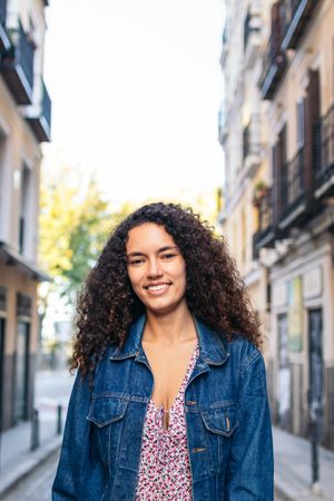 Portrait of a cheerful Black Latina woman outdoors