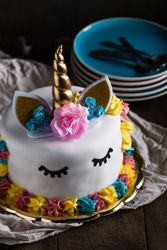 Cute unicorn cake with painted closed eyes