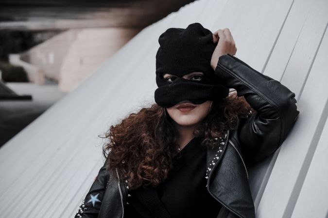 Woman in balaclava and leather jacket