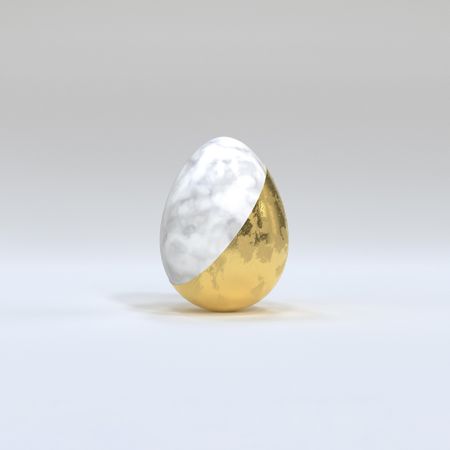 Gold and marble Easter egg on light background