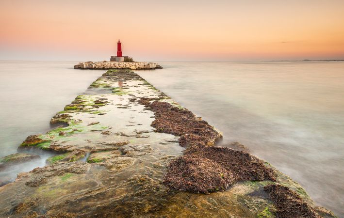 Rough path to islet with lighthouse