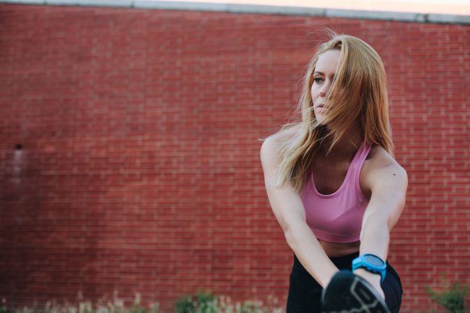Woman stretching after running