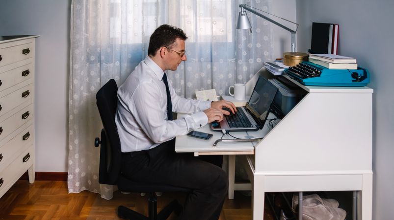 Man teleworking wearing shirt and tie