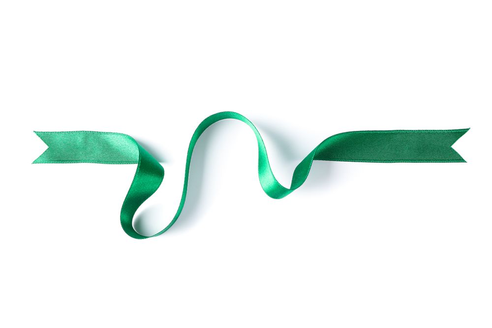 Green ribbon isolated on blank background. Gift concept