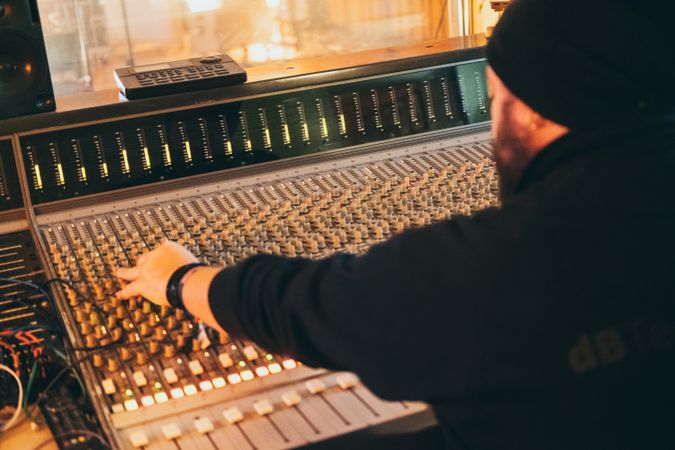 Man in a equalizer instrument in a studio