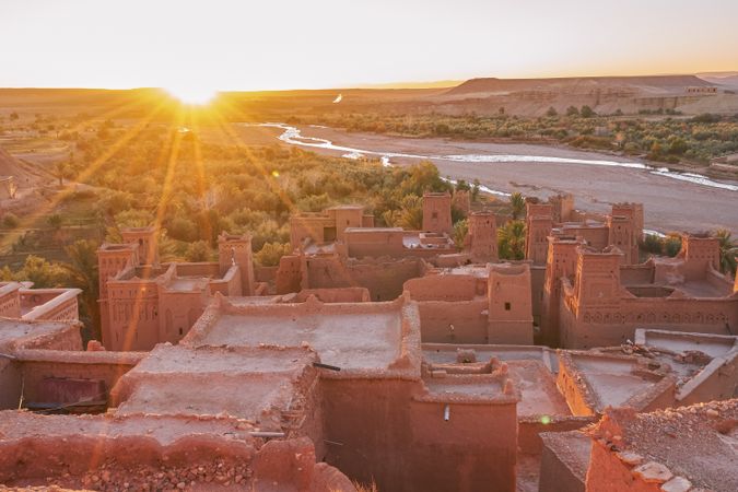 Ancient city near river in desert and wonderful sky