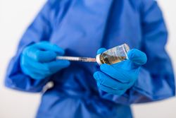 Healthcare worker holding coronavirus vaccine