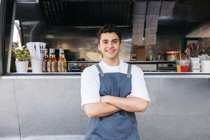 Portrait of a confident entrepreneur outside his business