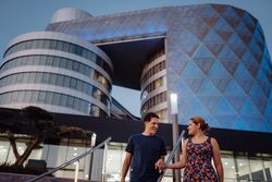 Romantic couple in sunlight in city street