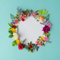 Spring wreath made of colorful flowers and leaves